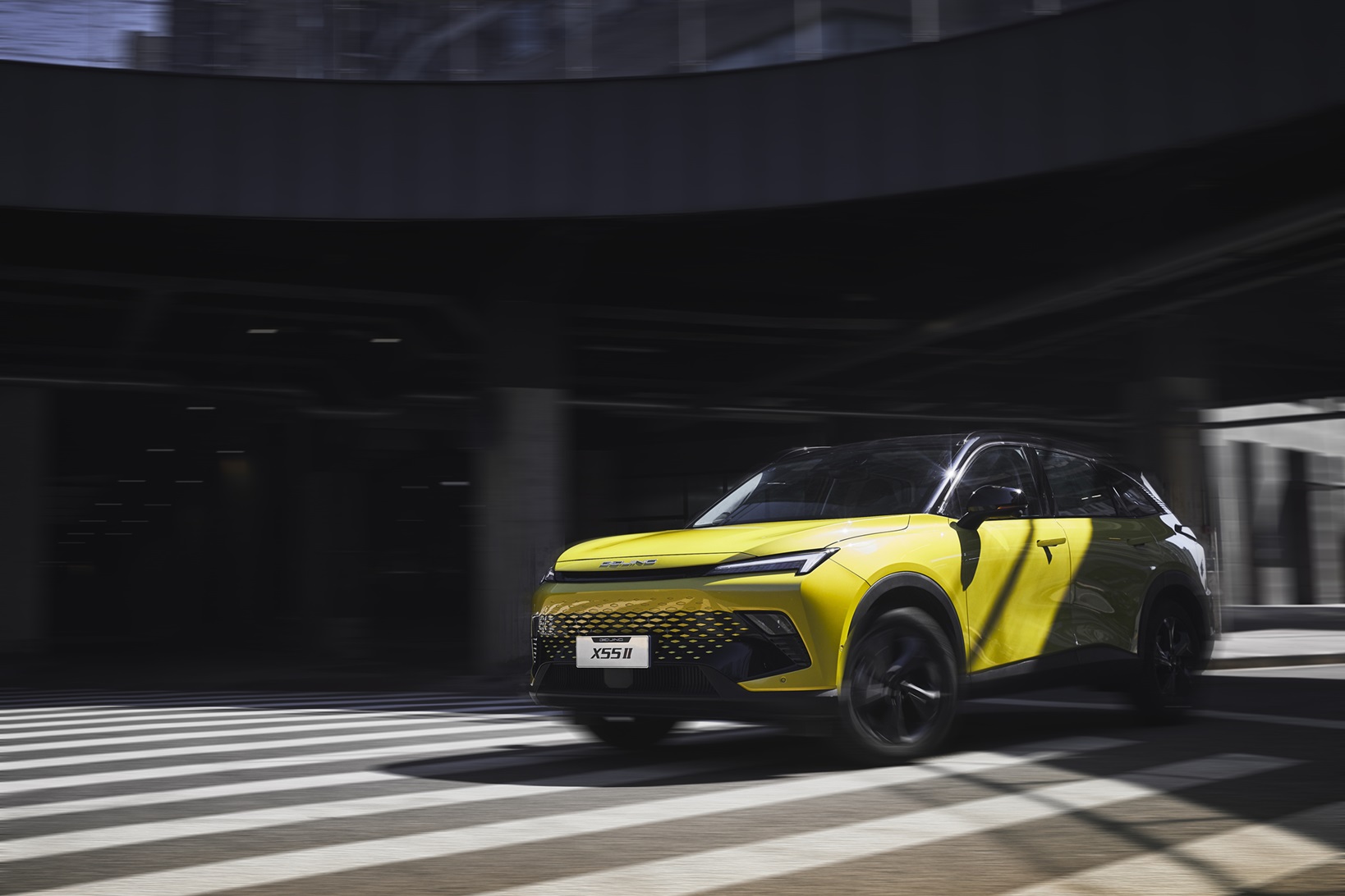 BAIC X55 compact SUV driving through a city underpass